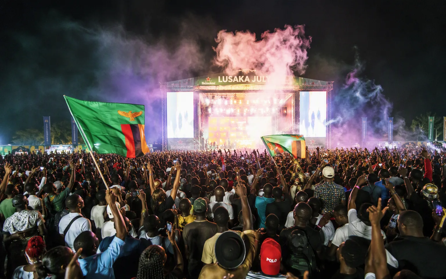 A huge night concert crowd with stage lights