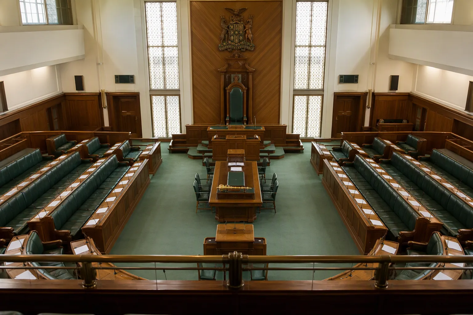 The chamber of the Zambian parliament with its empty Speaker's chair seen from the public gallery